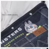 THE MONSTERS FALL IN WILD-SERIEN – Denim-messengerveske